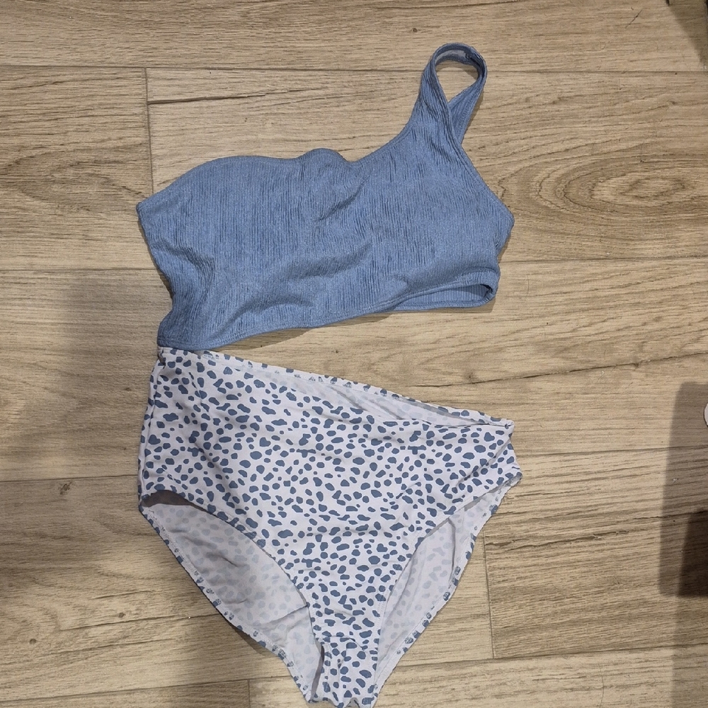 Blue One-Shoulder Bikini Top with White and Blue Patterned Bottoms.One Piece